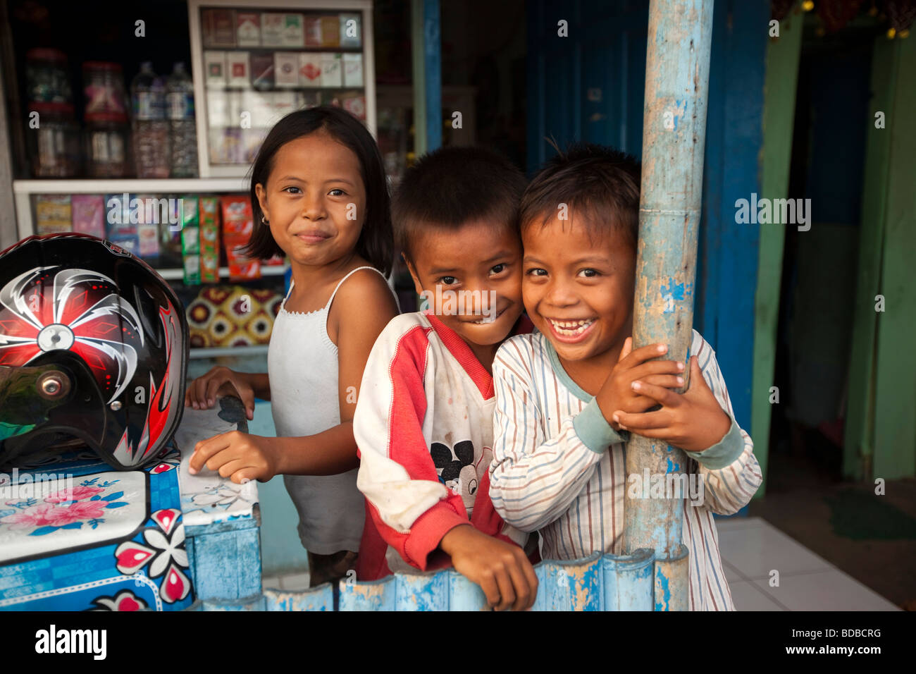 Indonesia Sulawesi West Coast Pare Pare children in doorway of Café Ono seafront bar Stock Photo