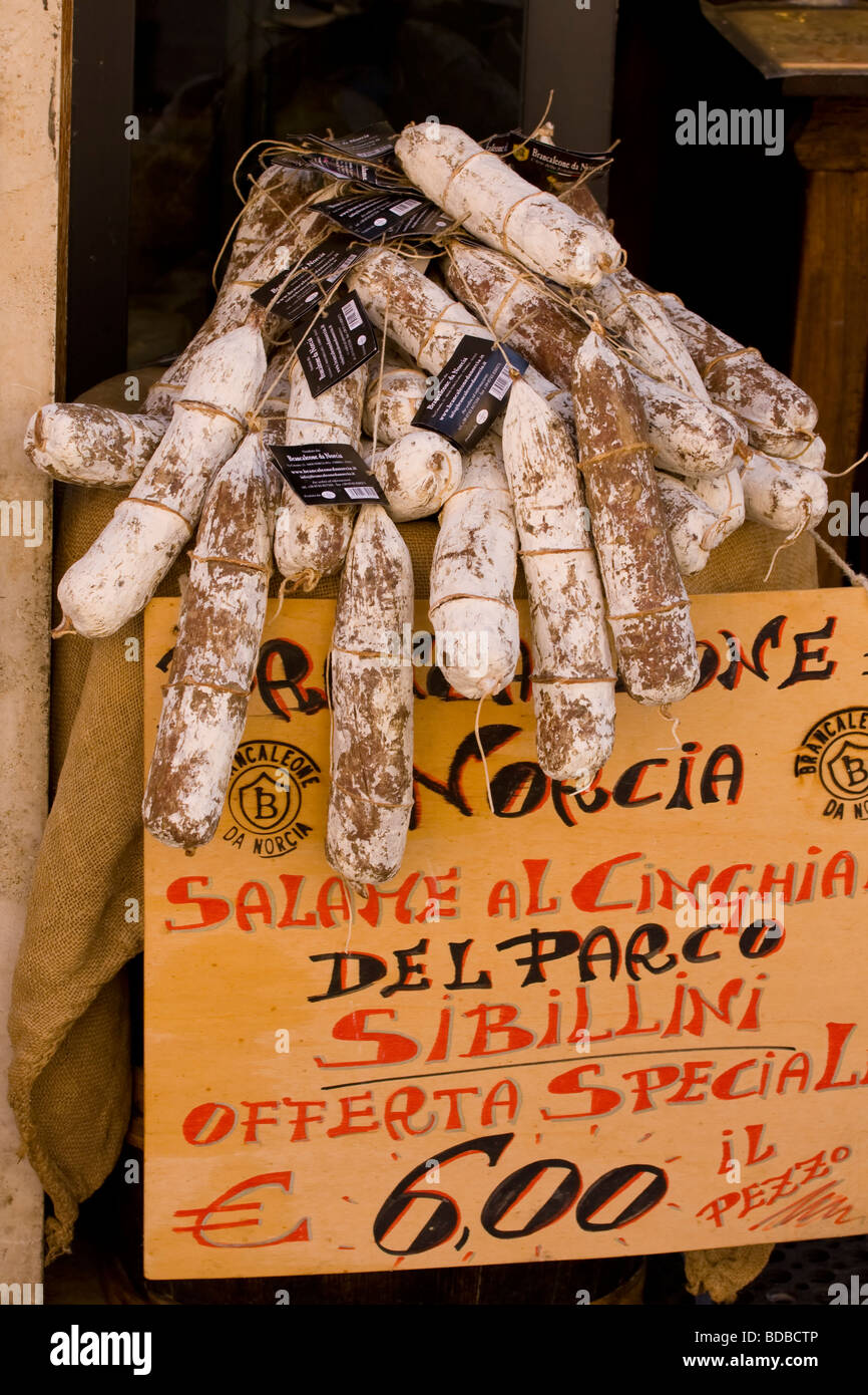 Salami and sausages hanging in shop Stock Photo