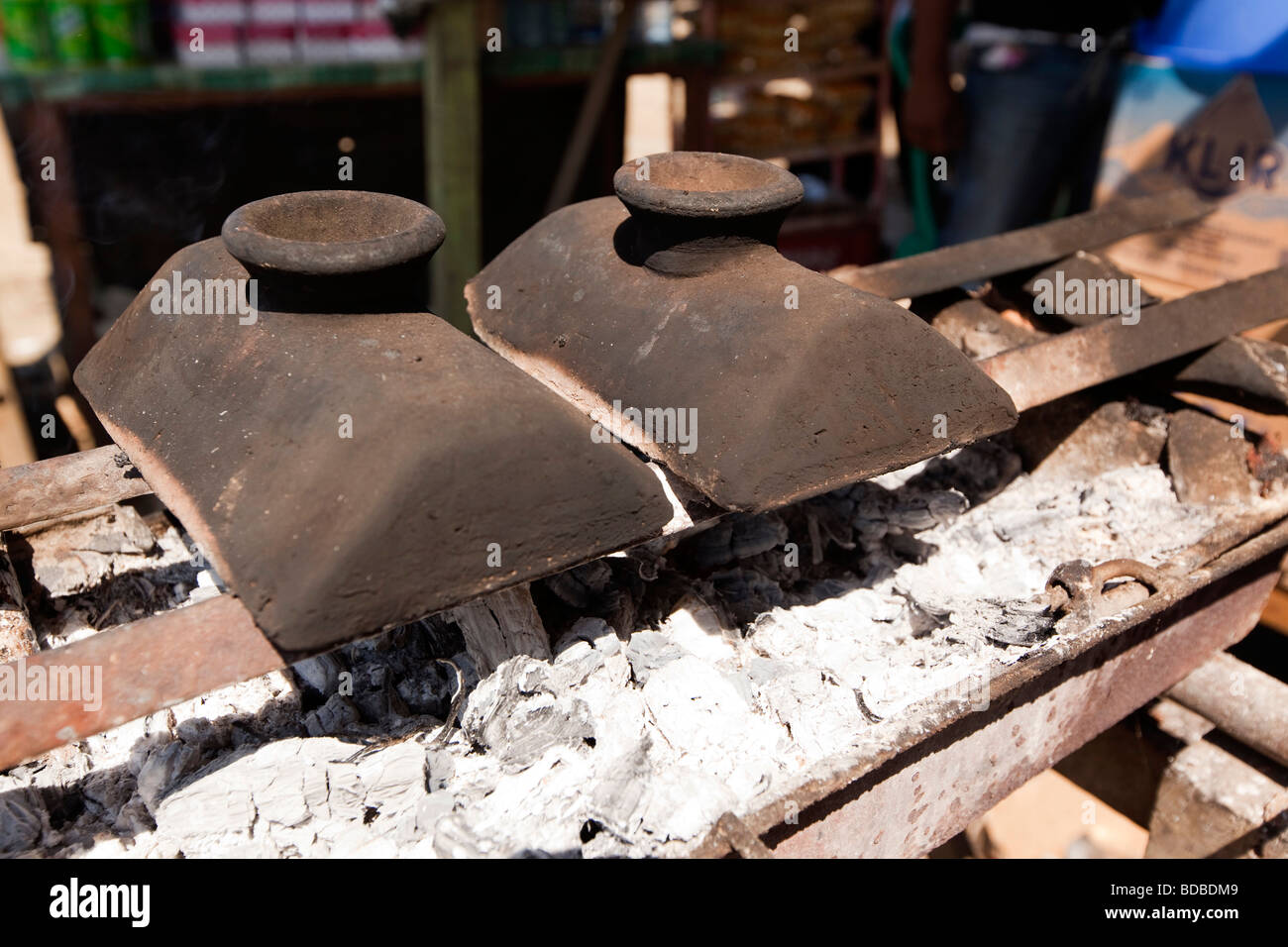 Indonesia Sulawesi Barru traditional ceramic bugis cooking pots on roadside café grill Stock Photo