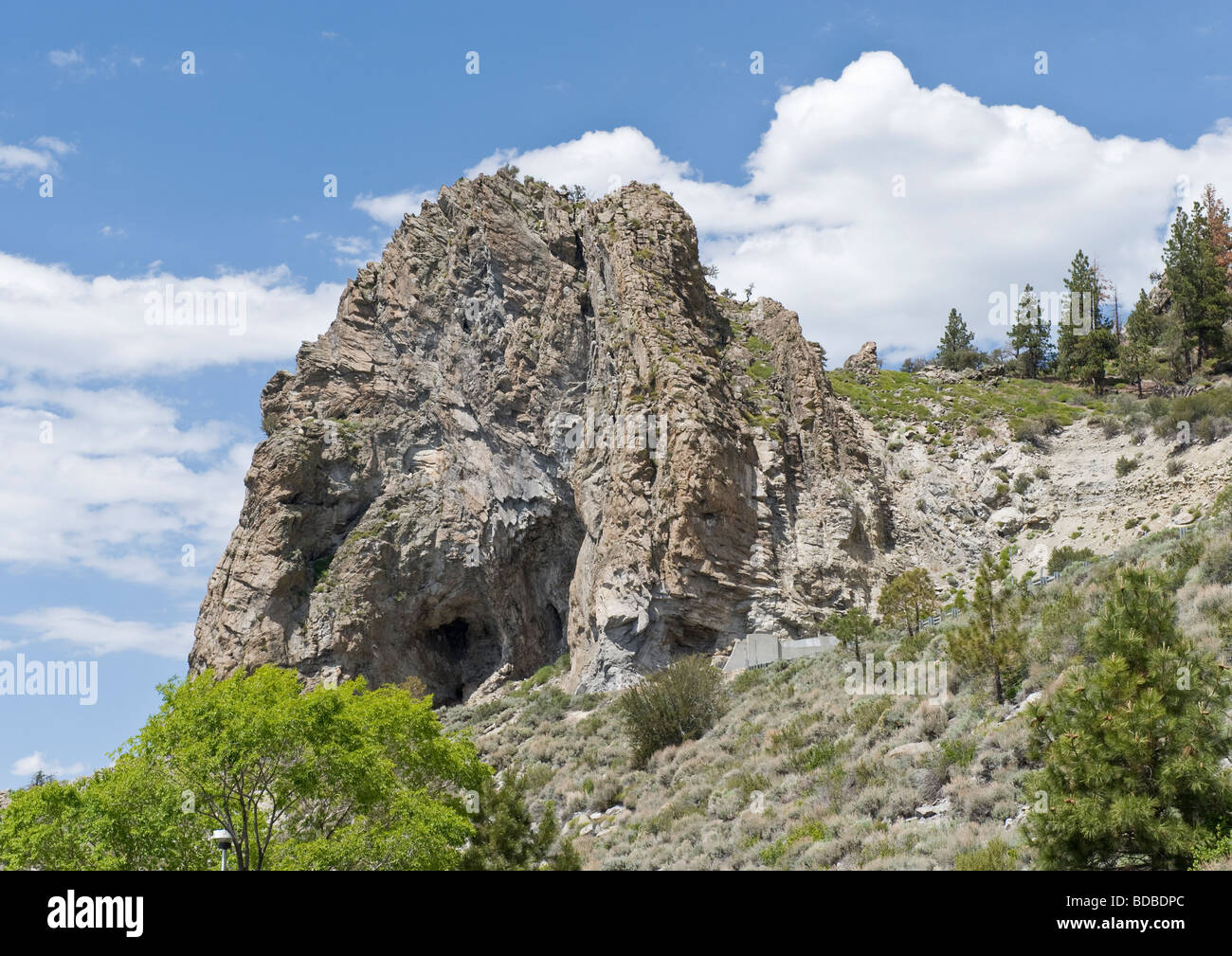 One of many natural rock formations with a cave in Yosemite valley where most rocks resemble figures of human body or animals. Stock Photo
