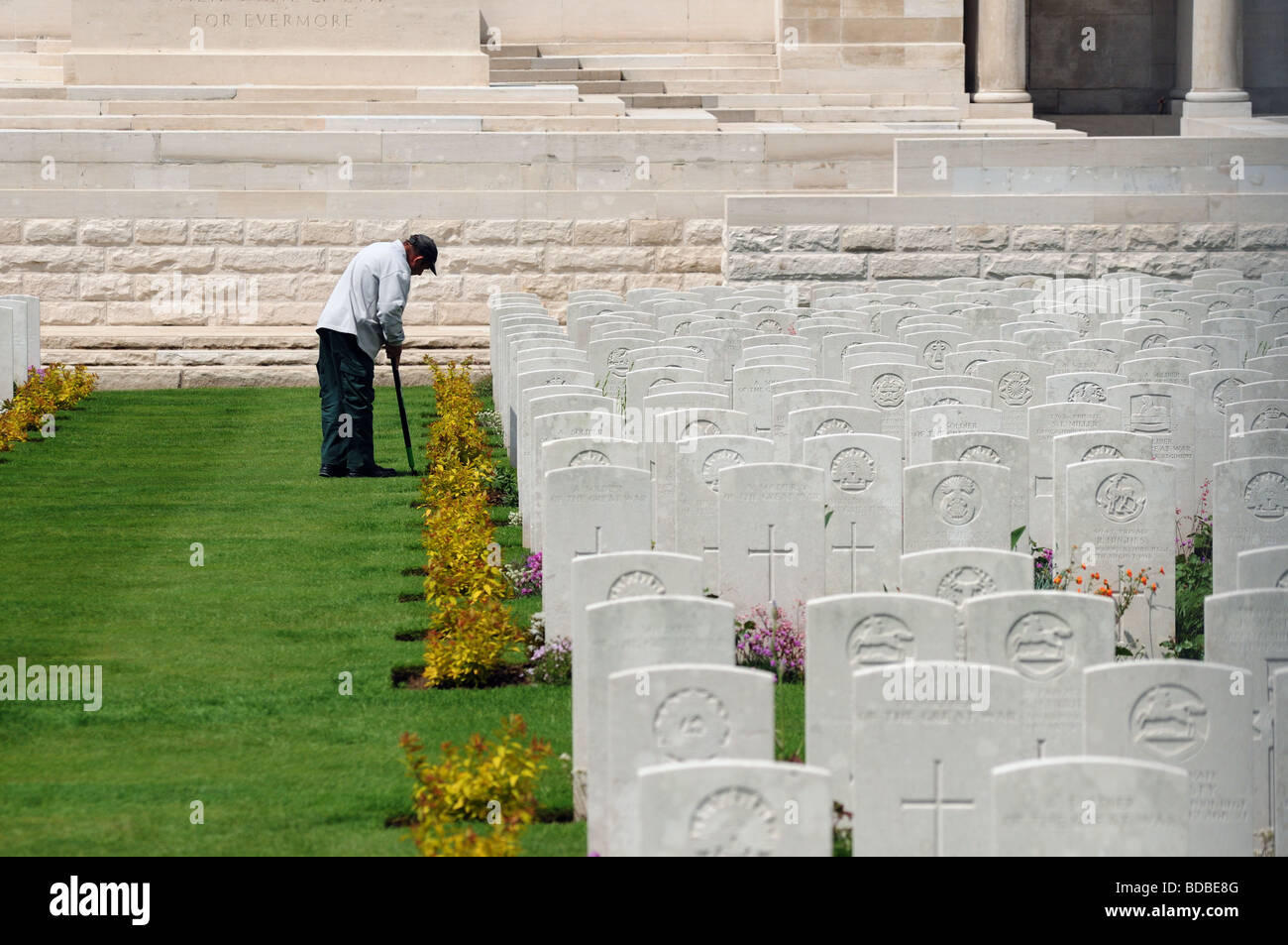 The grounds keeper working in Pozieres cemetery on The Somme Stock Photo