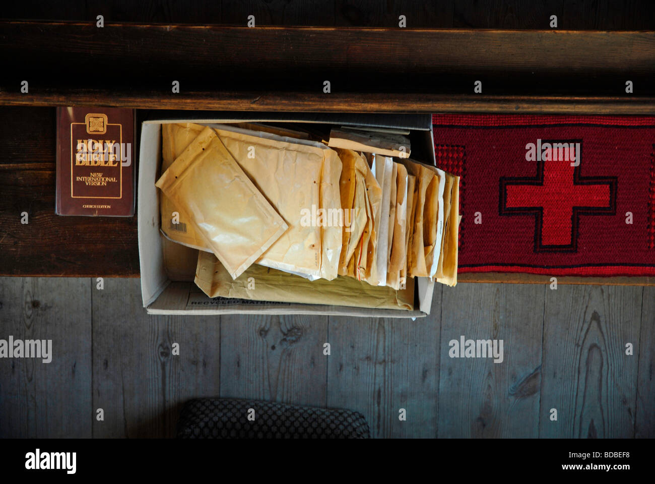 Parcels and pews Padded envelopes on a pew at the post office in a