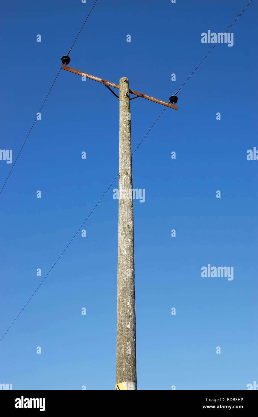 Power and cable on blue sky Stock Photo - Alamy