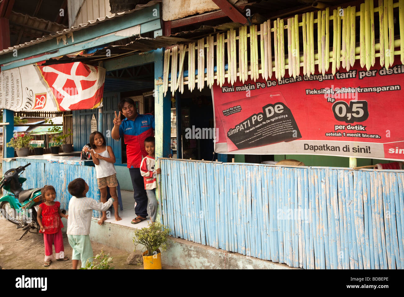 Indonesia Sulawesi West Coast Pare Pare children in doorway of Café Ono seafront bar Stock Photo