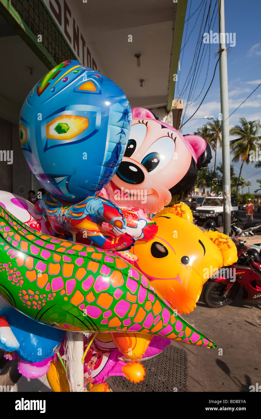 Indonesia Sulawesi Makassar Jalan Penghibur Walt Disney character balloons outside shop Stock Photo