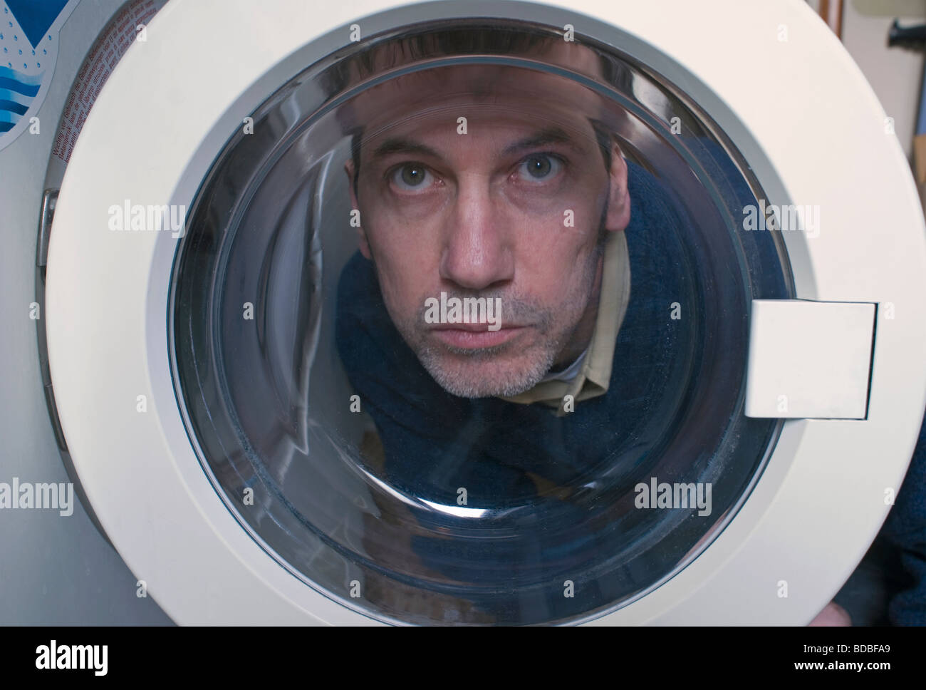 Man view through door of washing machine Stock Photo Alamy