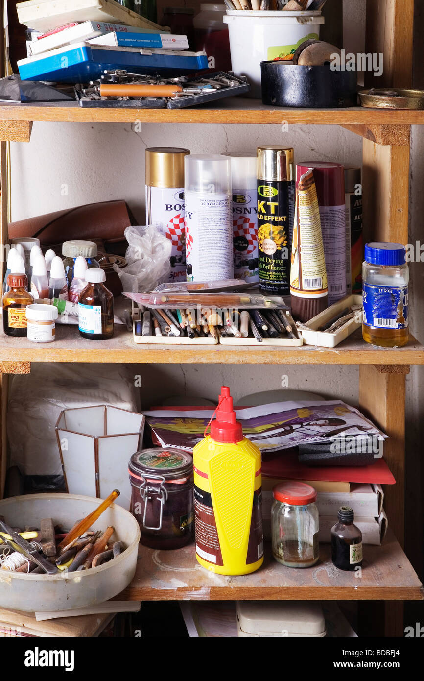 different objects on shelf in workshop Stock Photo