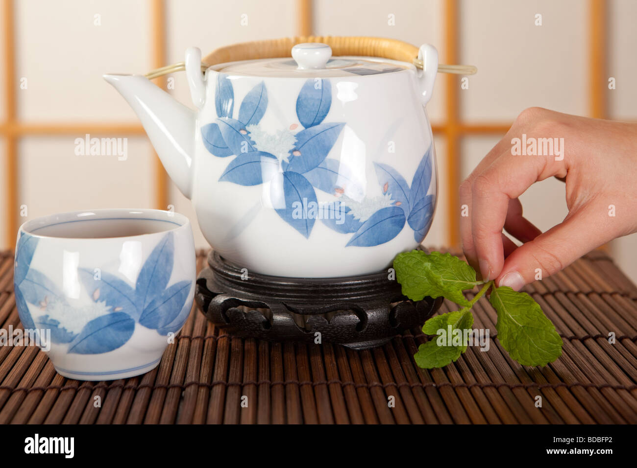 Japanese green tea in a traditional room with shoji sliding windows ...