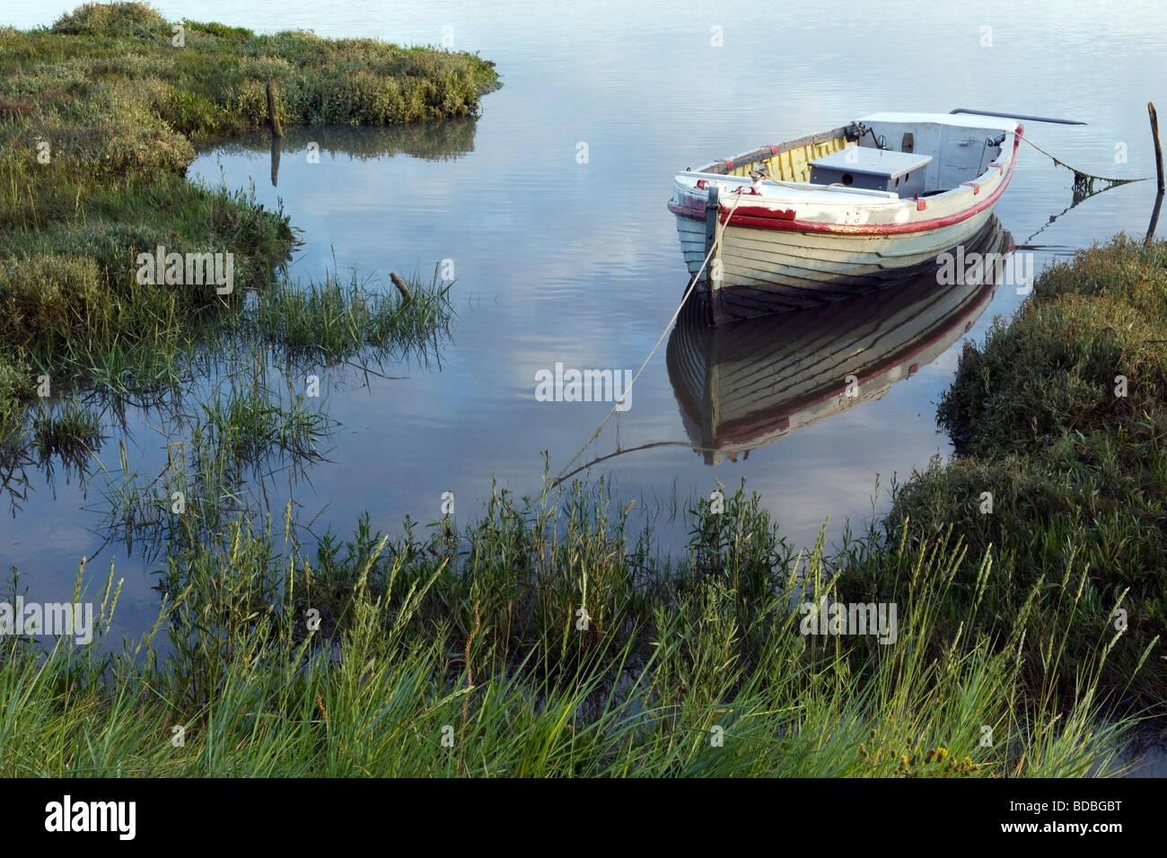 Traditional fishing boat reflected in the River Stour (1), Essex, England Stock Photo