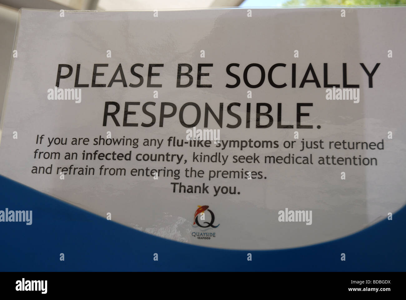 Be Socially Responsible notice regarding flu-like symptoms, outside restaurant on Clarke Quay, Singapore Stock Photo