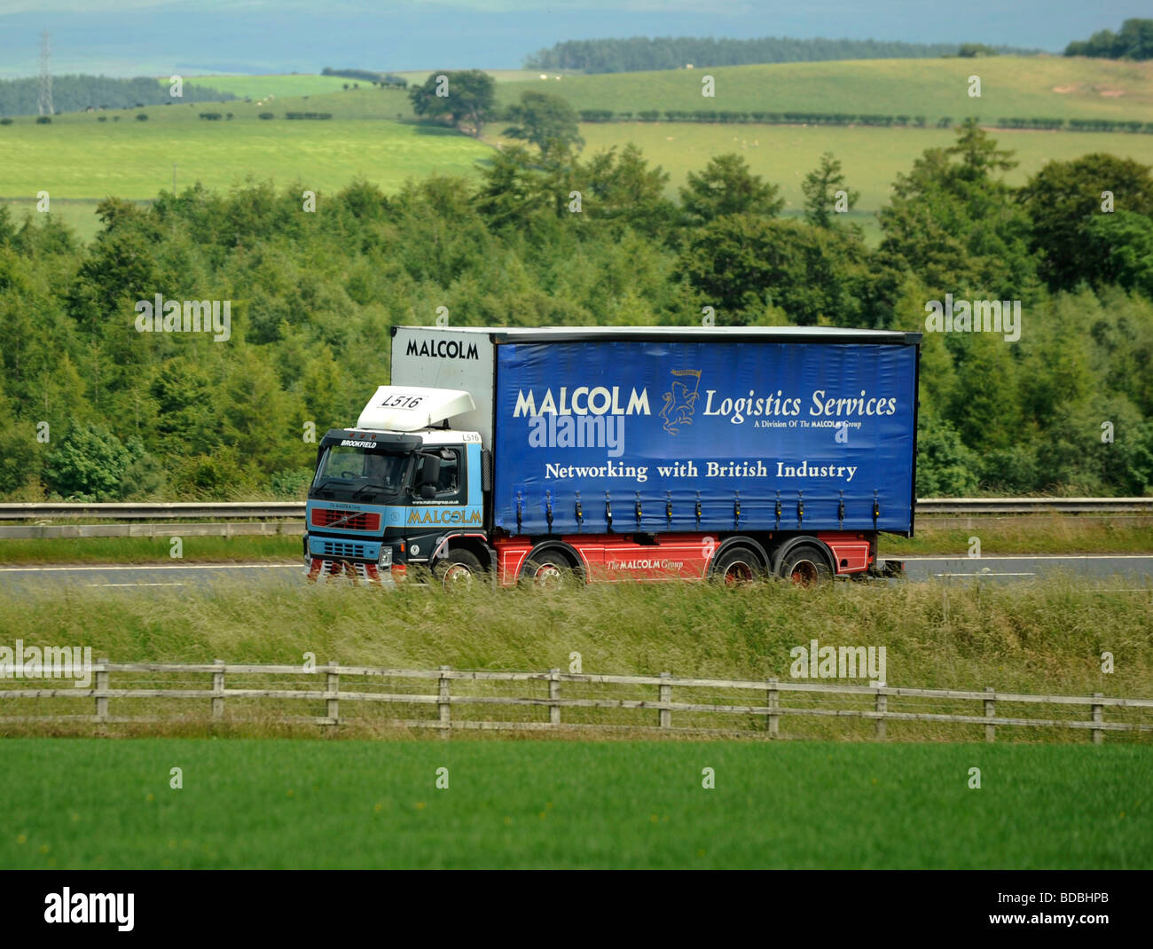 four axle eight wheeler rigid curtainsided truck W H Malcolm logistics services Stock Photo