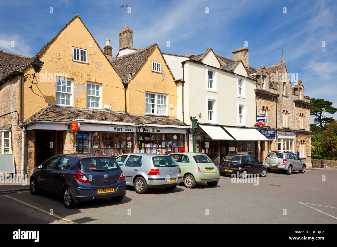 Row of shops and village Post Office at Northleach village Stock Photo