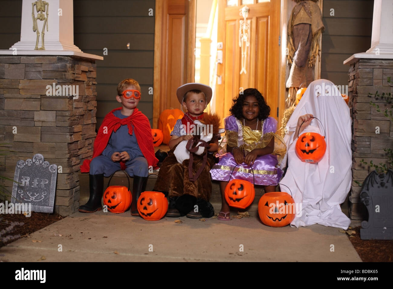 Group of kids in Halloween costumes Stock Photo