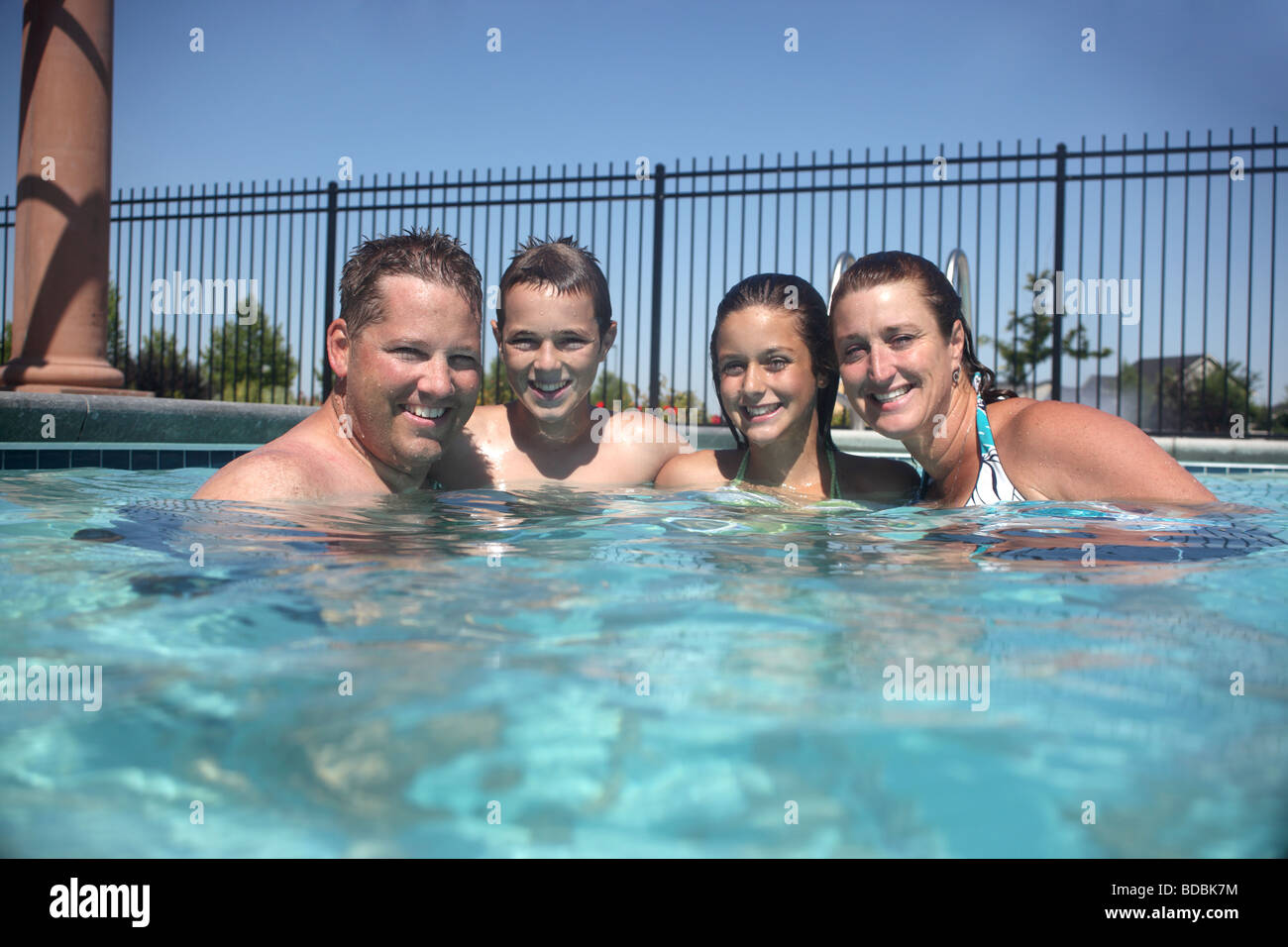 Family portrait in pool Stock Photo