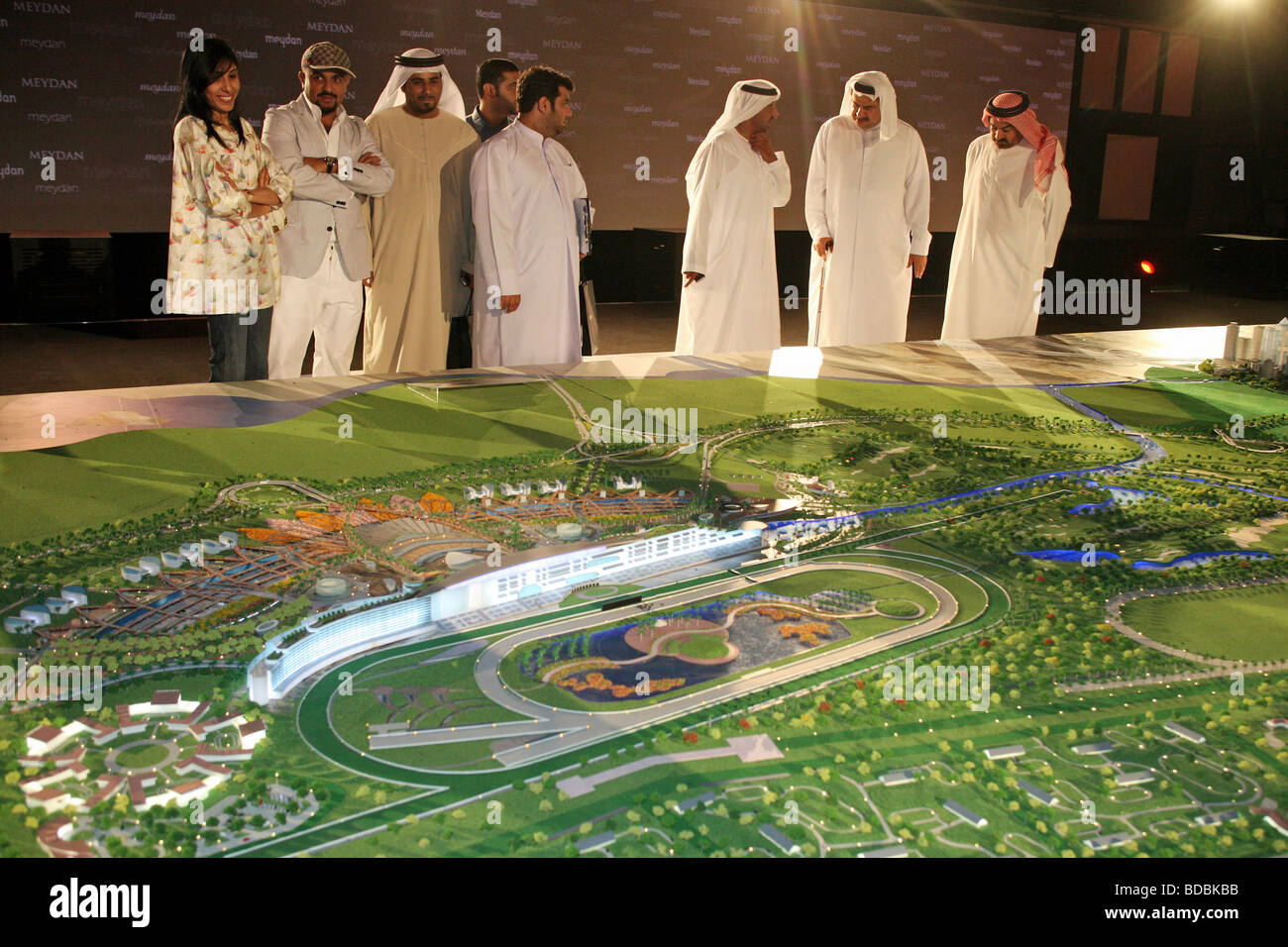 Arabs watching the new race course model, Dubai, United Arab Emirates Stock Photo
