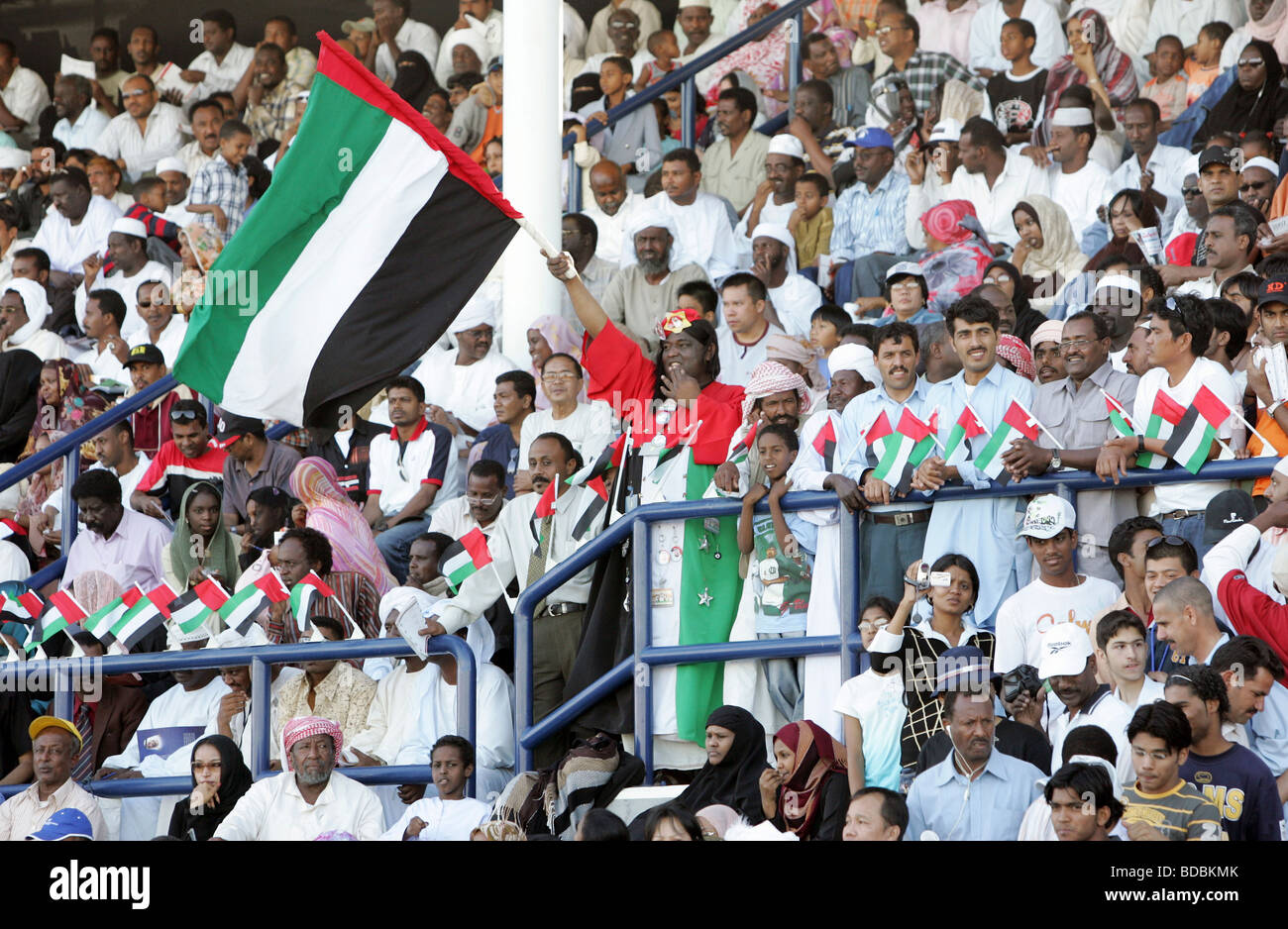 People with national flags, Dubai, United Arab Emirates Stock Photo