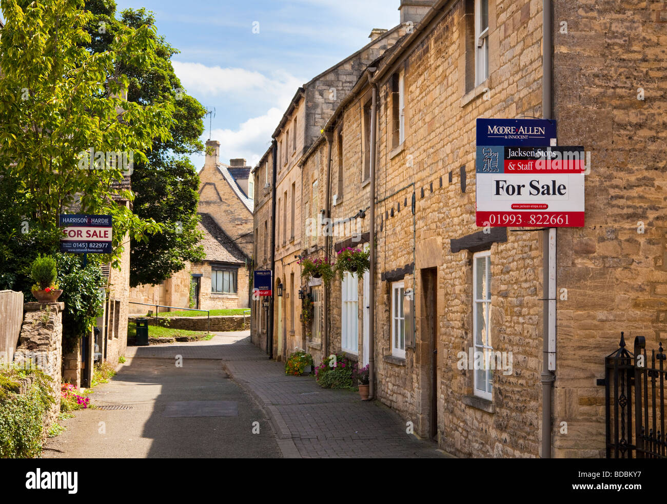 House for sale sign on a village property in Northleach, Gloucestershire, UK Stock Photo