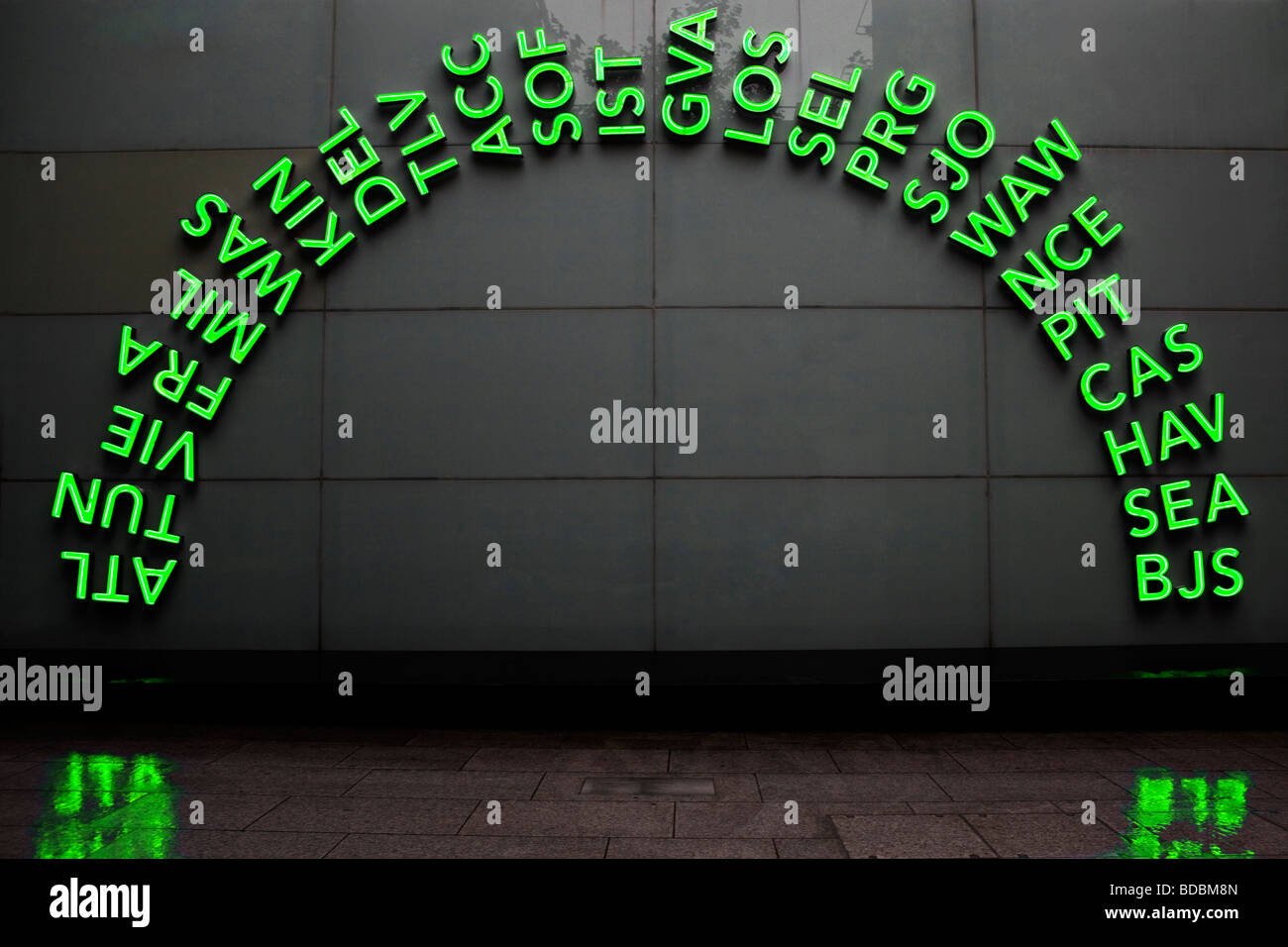 Green Neon Sign at Heathrow Airport Stock Photo