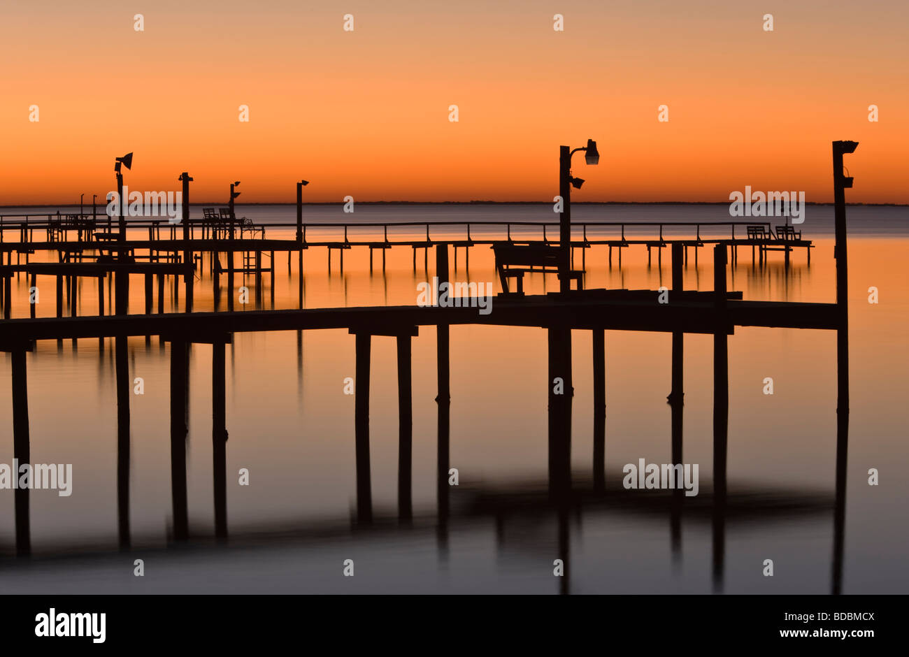 Silhouetted piers, sunset, Copano Bay, Texas Stock Photo