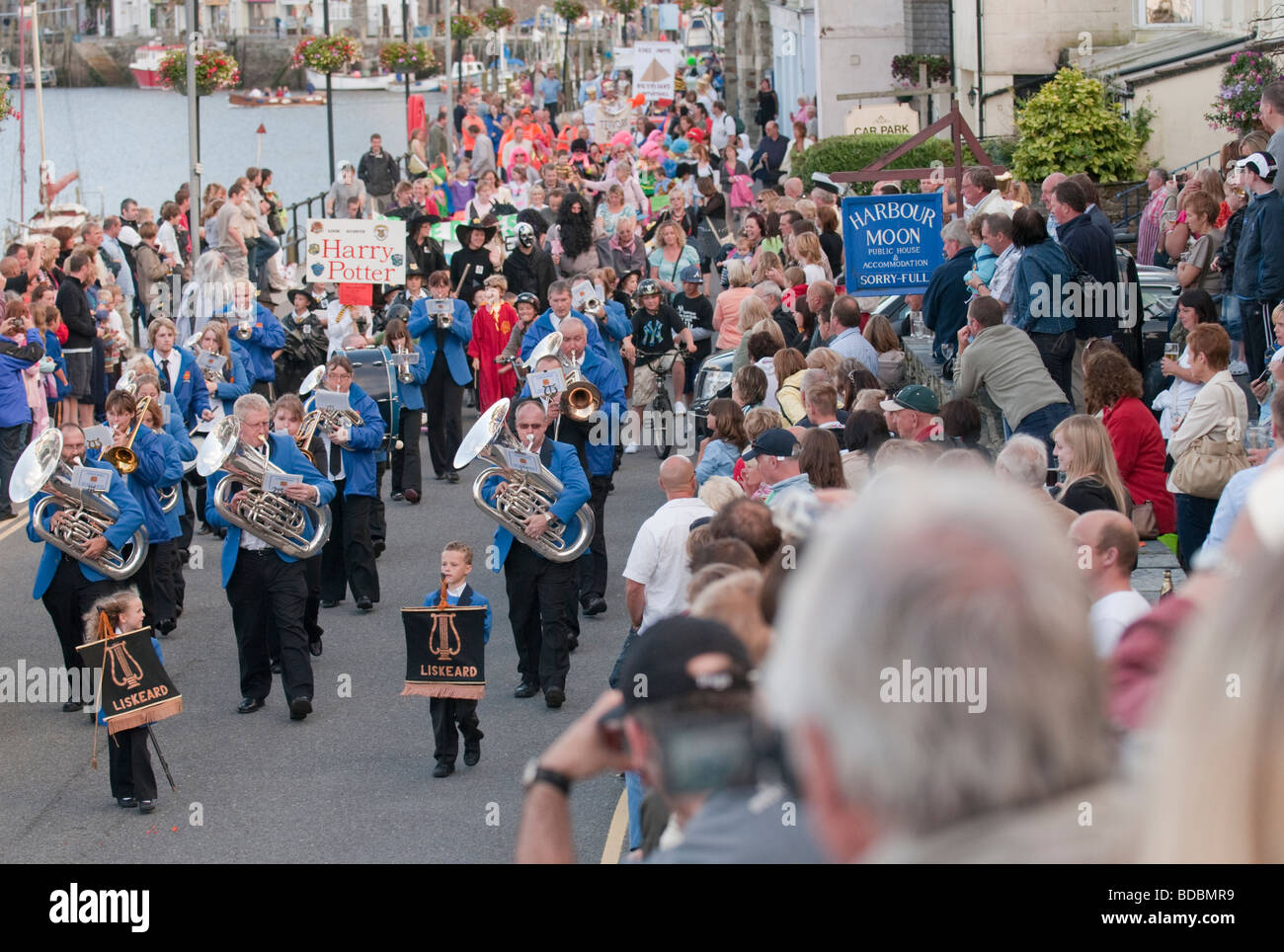 Looe Carnival, Liskeard Town Band parade down Quay Road West Looe, South East Cornwall. Stock Photo