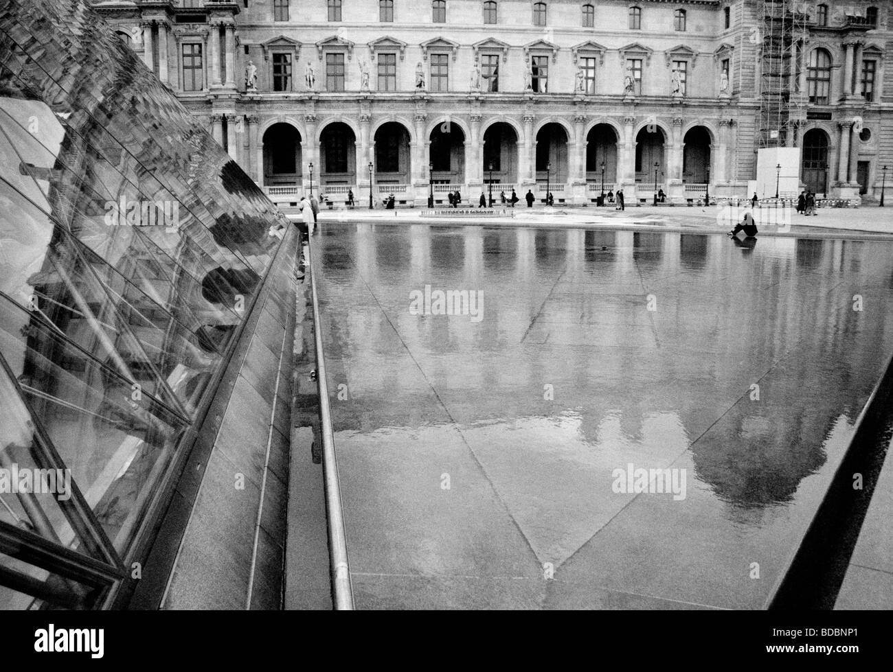 Louvre Glass Pyramid and water fountain in front of the Musee du Louvre, Paris, France Stock Photo
