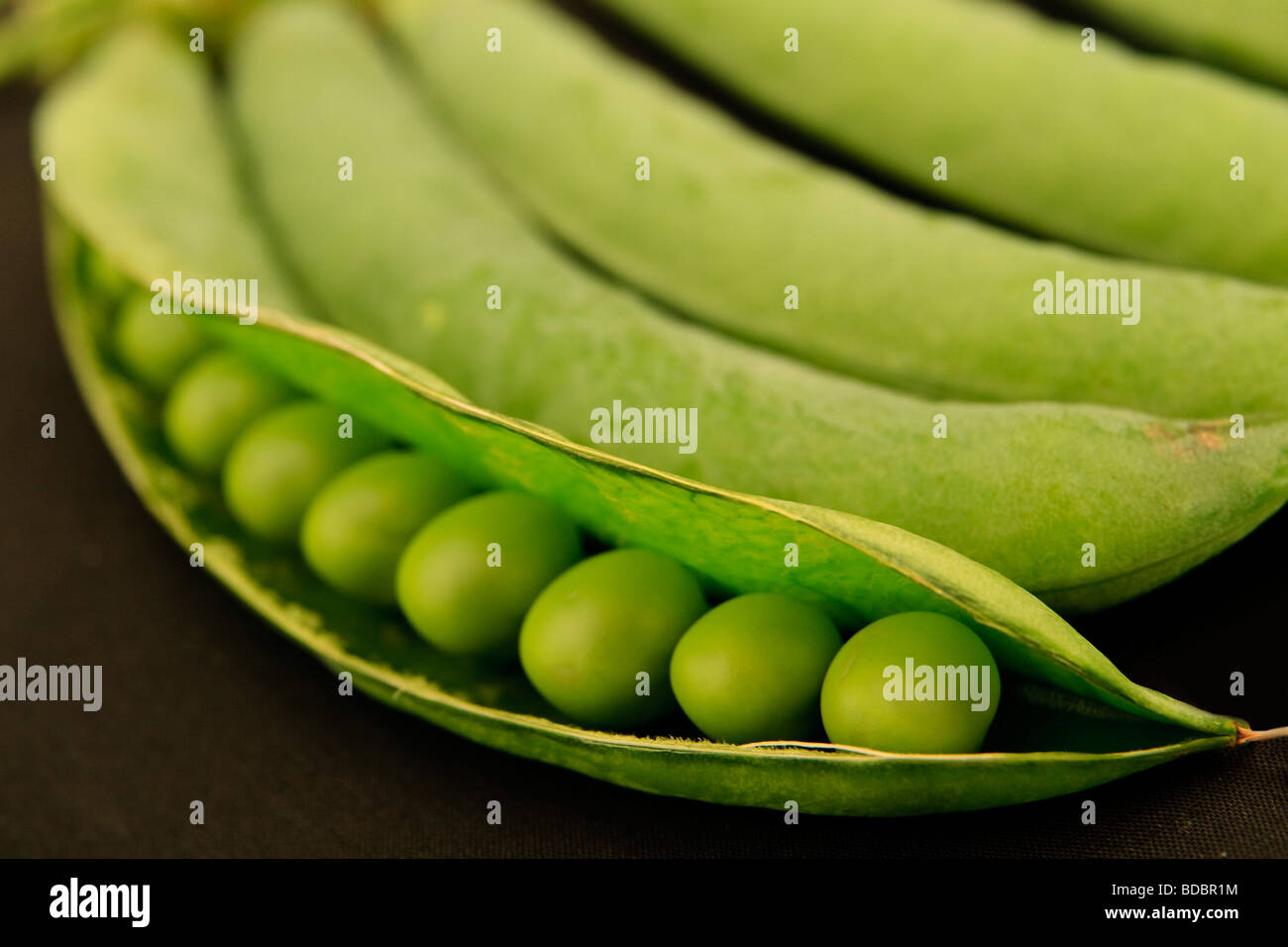 Macro image of green peas in pod Stock Photo