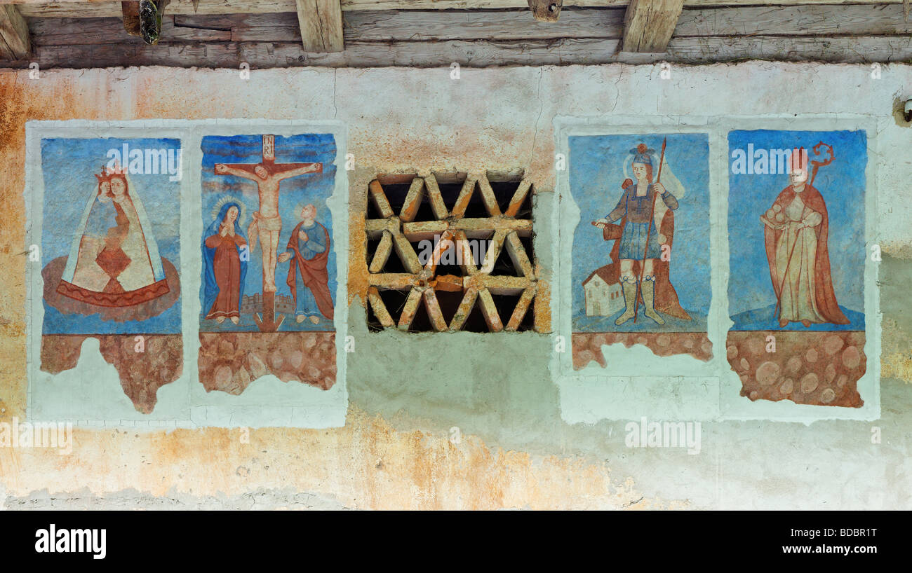 Religious fresco on the exterior wall of a farm barn, Robanov Kot, Upper Savinja Valley, Stajerska, Slovenia. Stock Photo