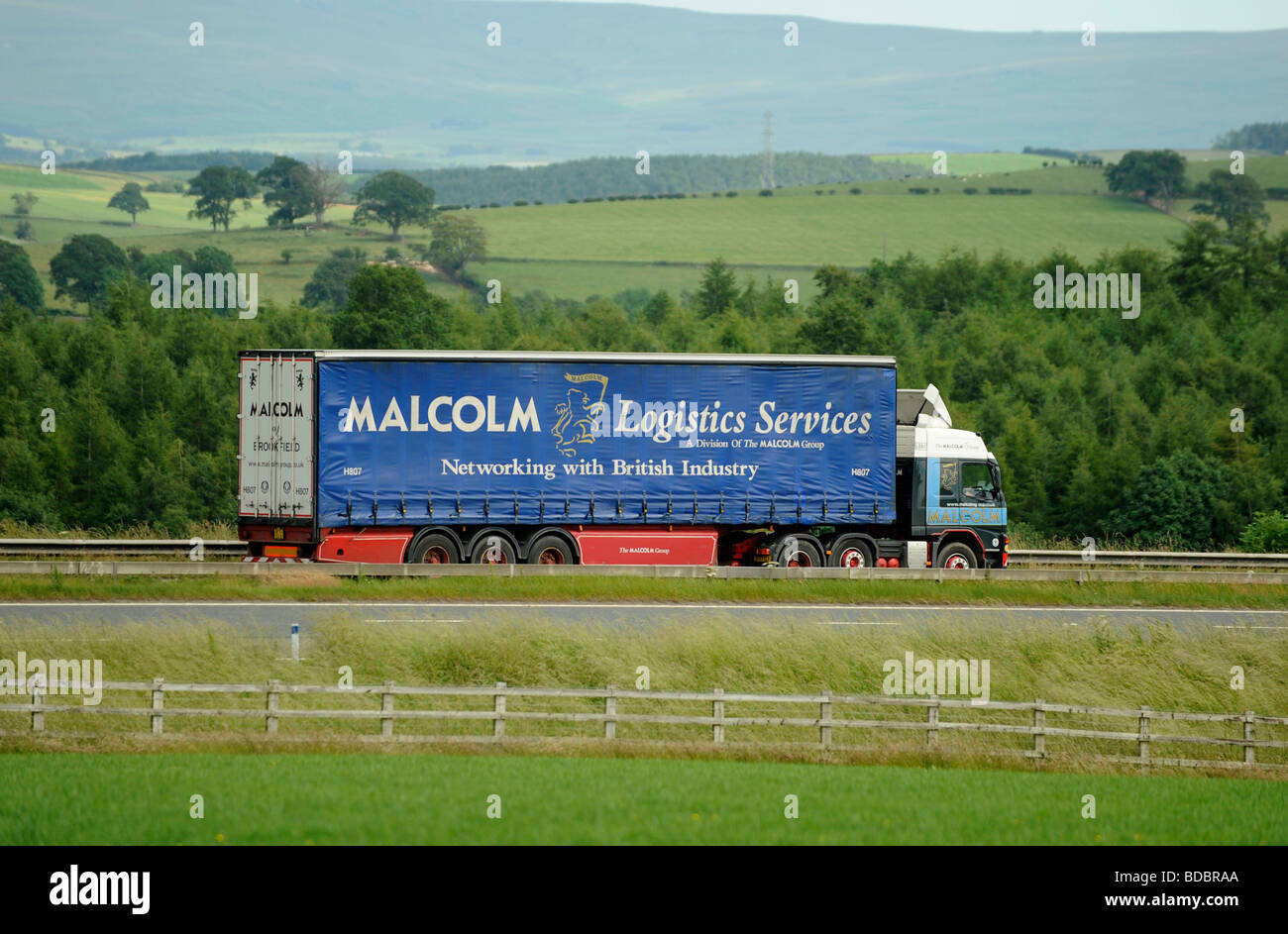 Volvo FM truck with curtainsided trailer W H Malcolm Logistics Services Stock Photo