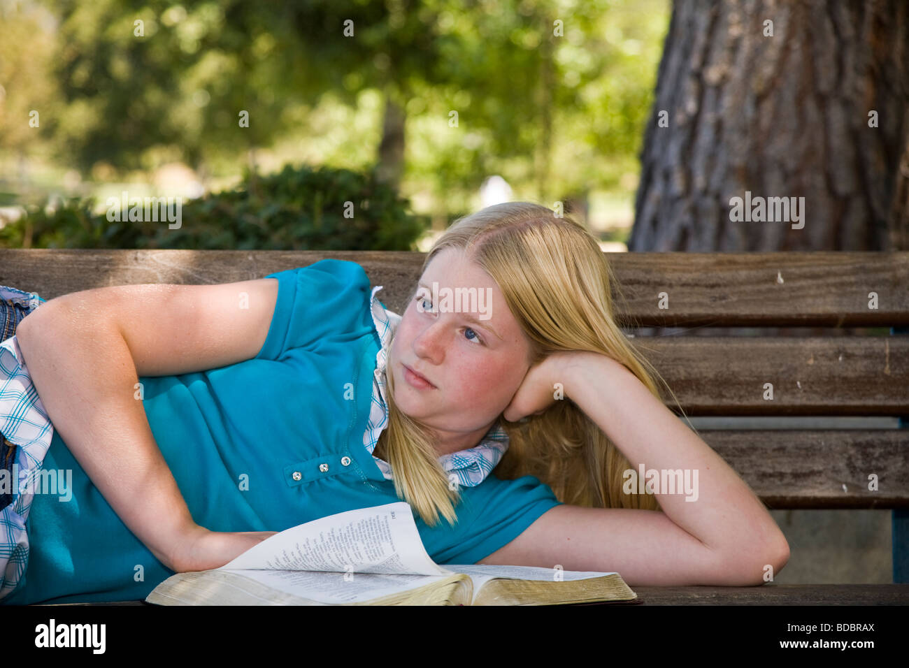 11 12 13 year old child children young person people Tween tweens Caucasian Junior high girl meditating reflecting thoughtful dreaming sitting     © Myrleen Pearson Stock Photo