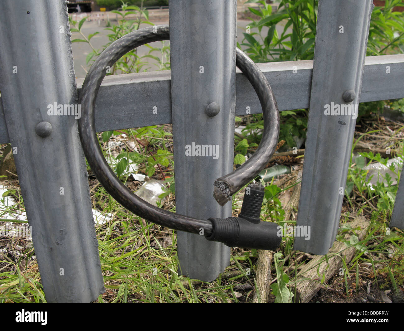 Cycle theft cut bike cable lock on security fence Stock Photo Alamy