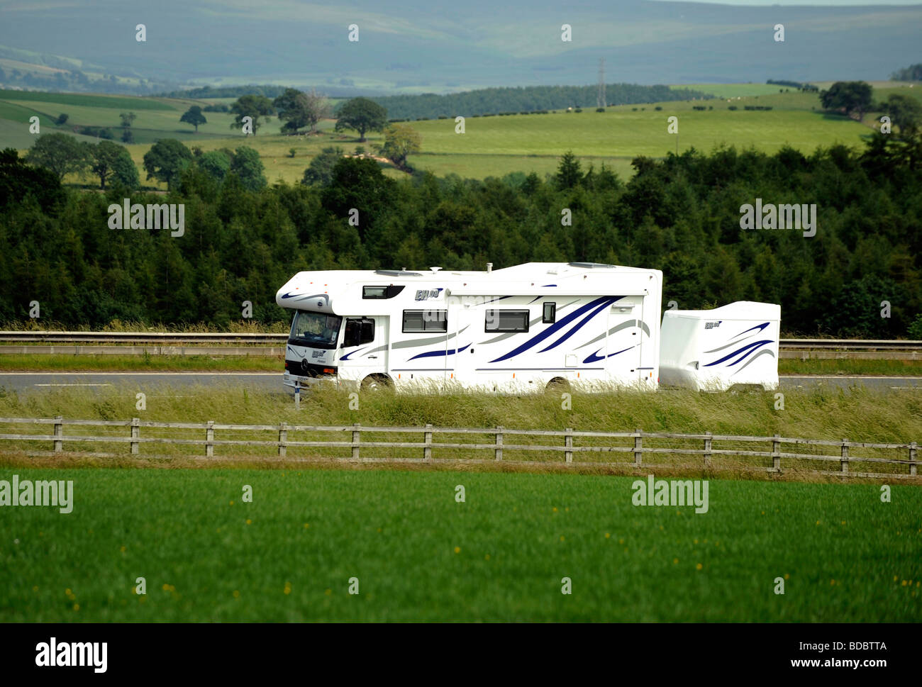 Mercedes camper van RV recreational vehicle and small trailer Stock Photo