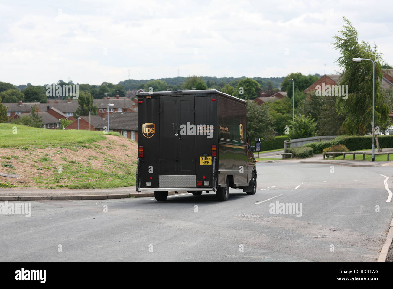 A UPS parcel delivery van driving on a British road Stock Photo