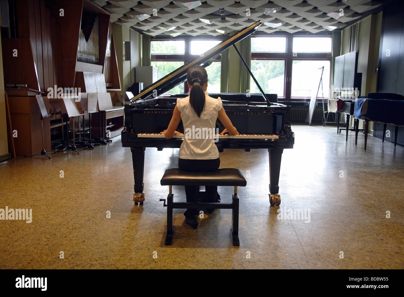 Young student playing piano at the Robert Schumann University, Duesseldorf, Germany Stock Photo