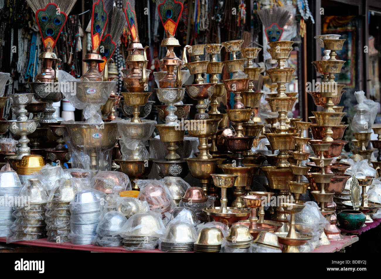 brass oil burners chalices for sale in the market bazaar near Boudhanath  temple shrine buddhist temple Stock Photo