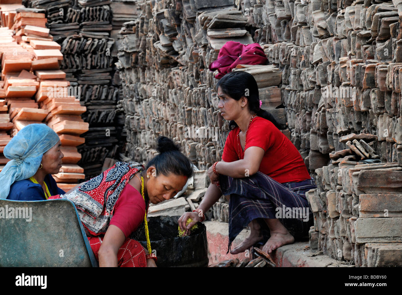 women working construction hard labor labour roof tiles tiling