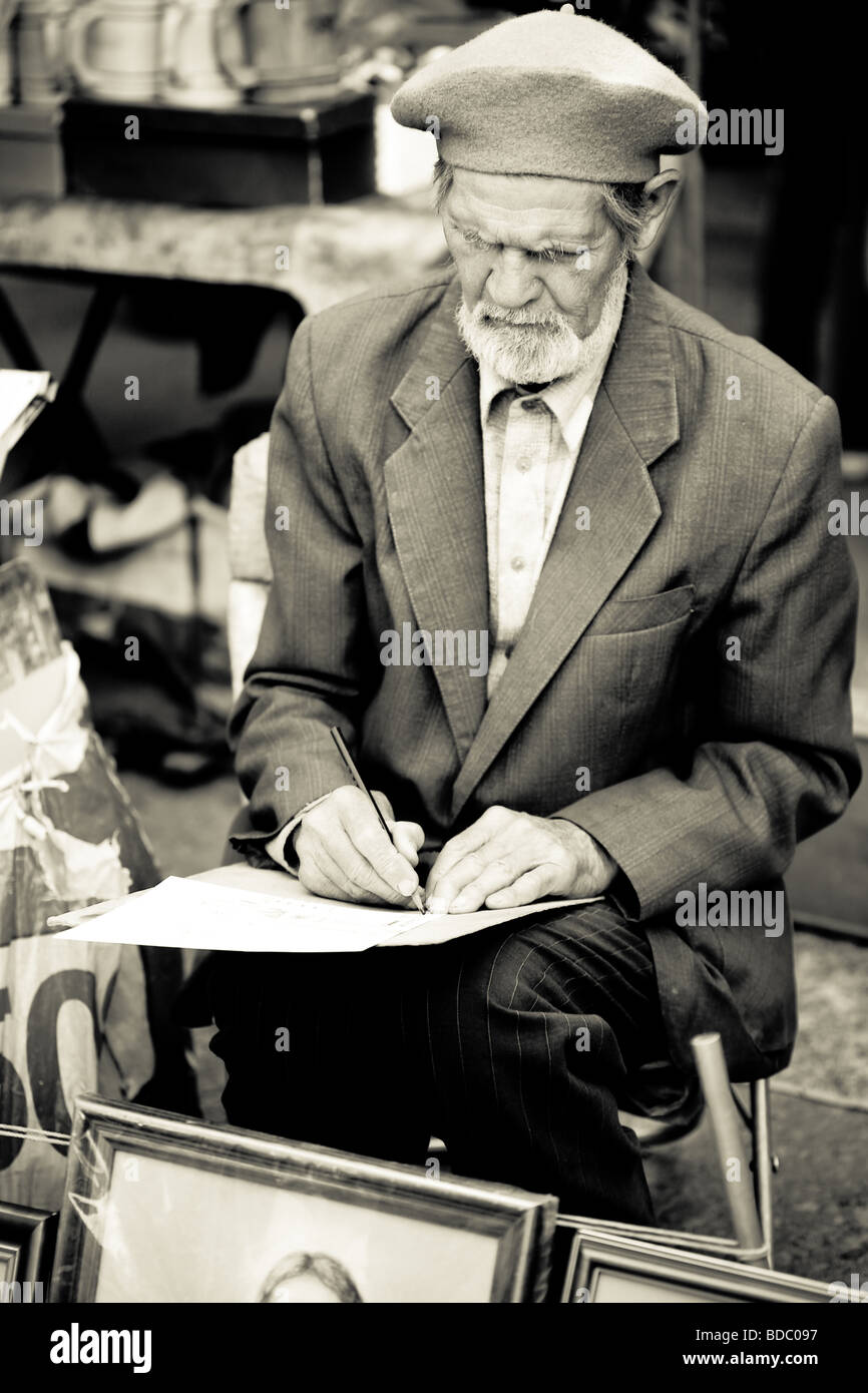 senior man painting on a canvas Stock Photo - Alamy