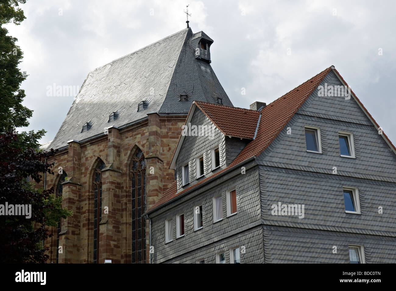 House and part of the Marienkapelle in Frankenberg, Hesse, Germany Stock Photo