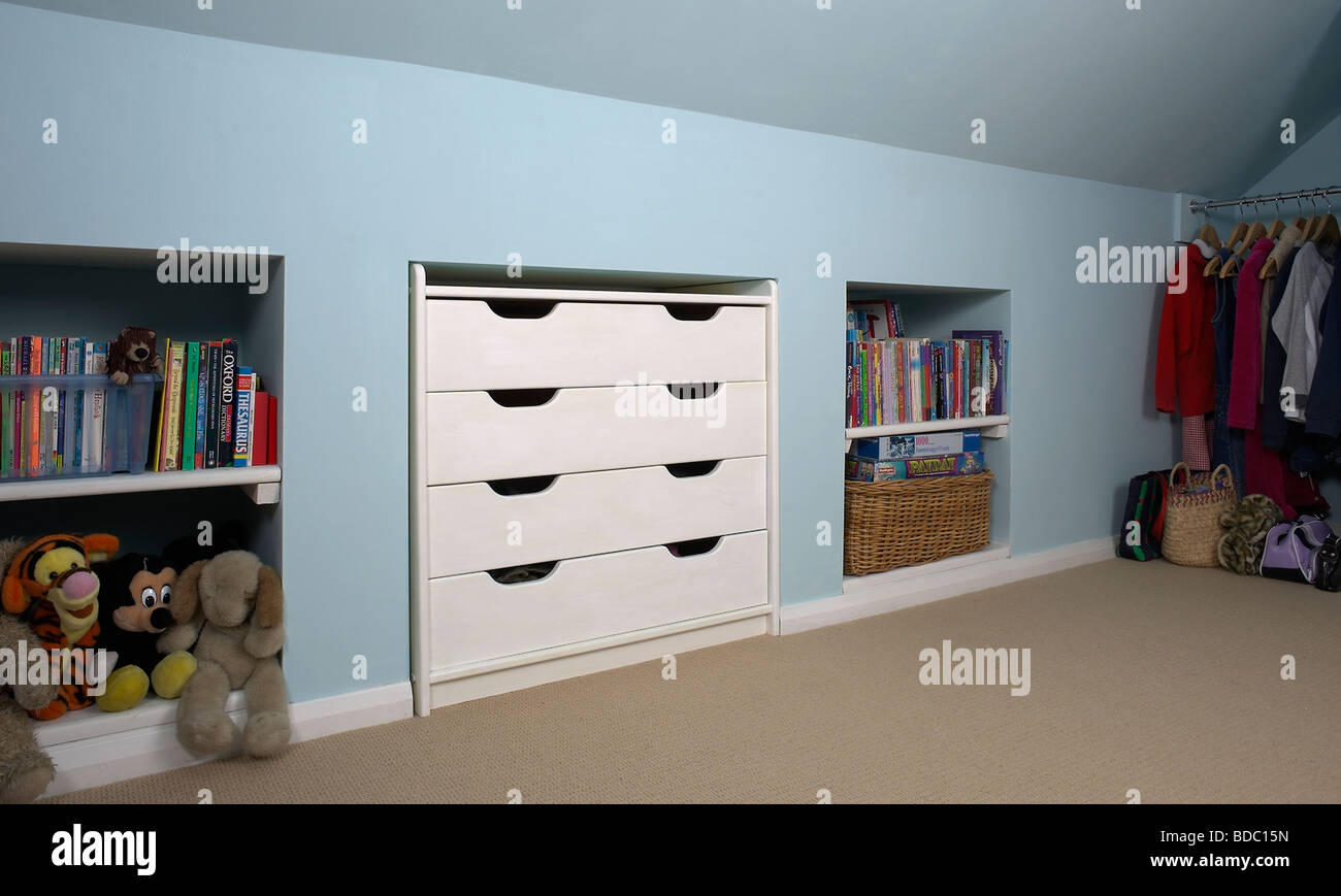White Fitted Storage Drawers And Alcove Shelves In Pastel