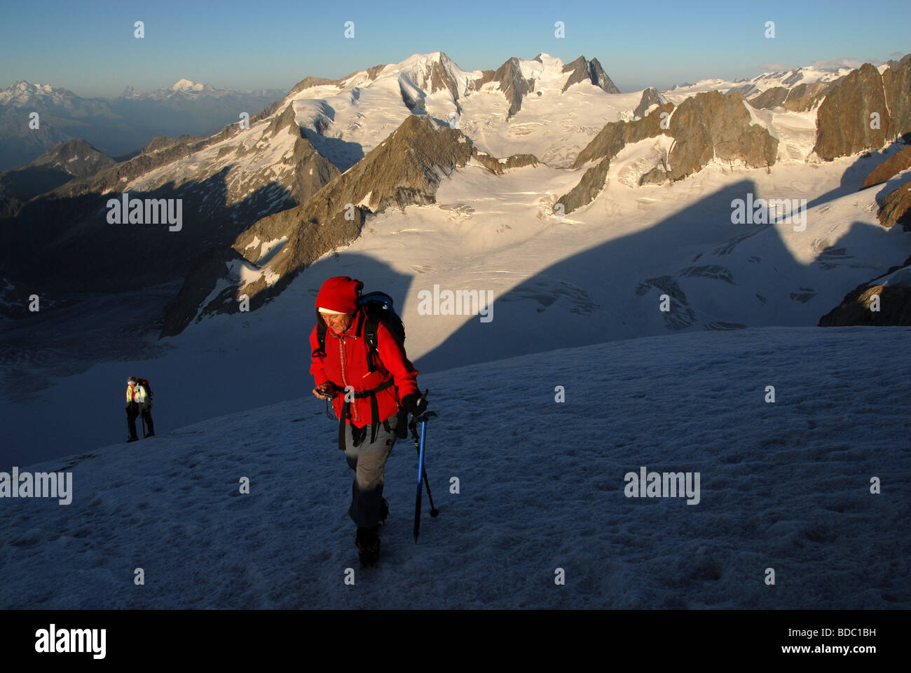 Mountain climbers on Oberaarhonr 3631 m, in back Wannenhorn Bernese alps Switzerland Stock Photo
