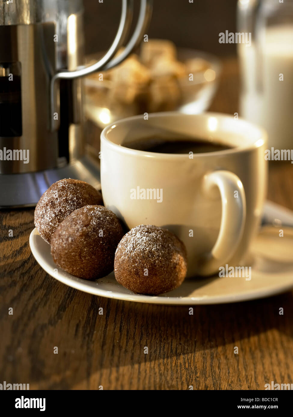 black coffee with donut balls Stock Photo Alamy