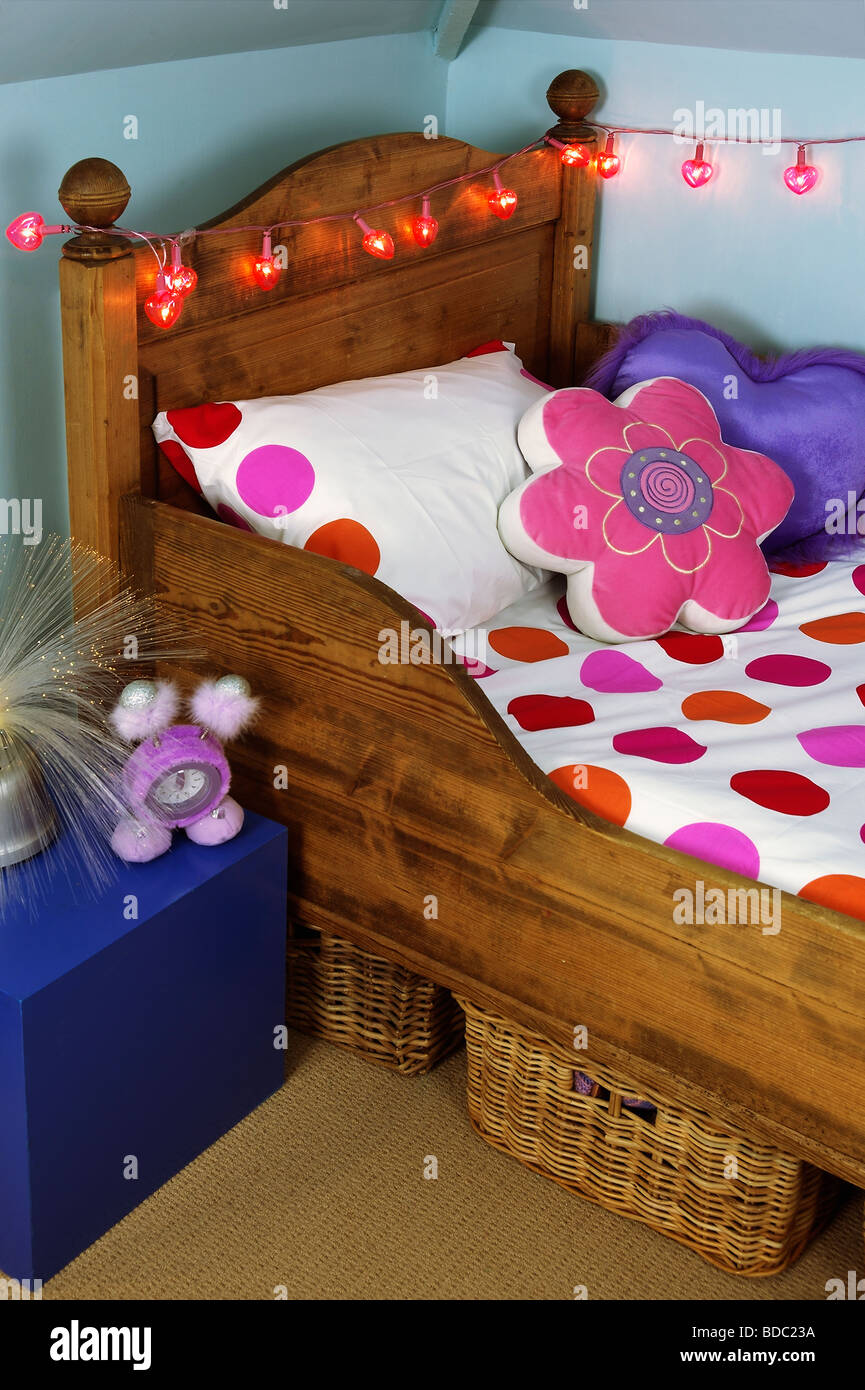 Flower Shaped Cushion And Pink And Red Spotted Bedlinen On