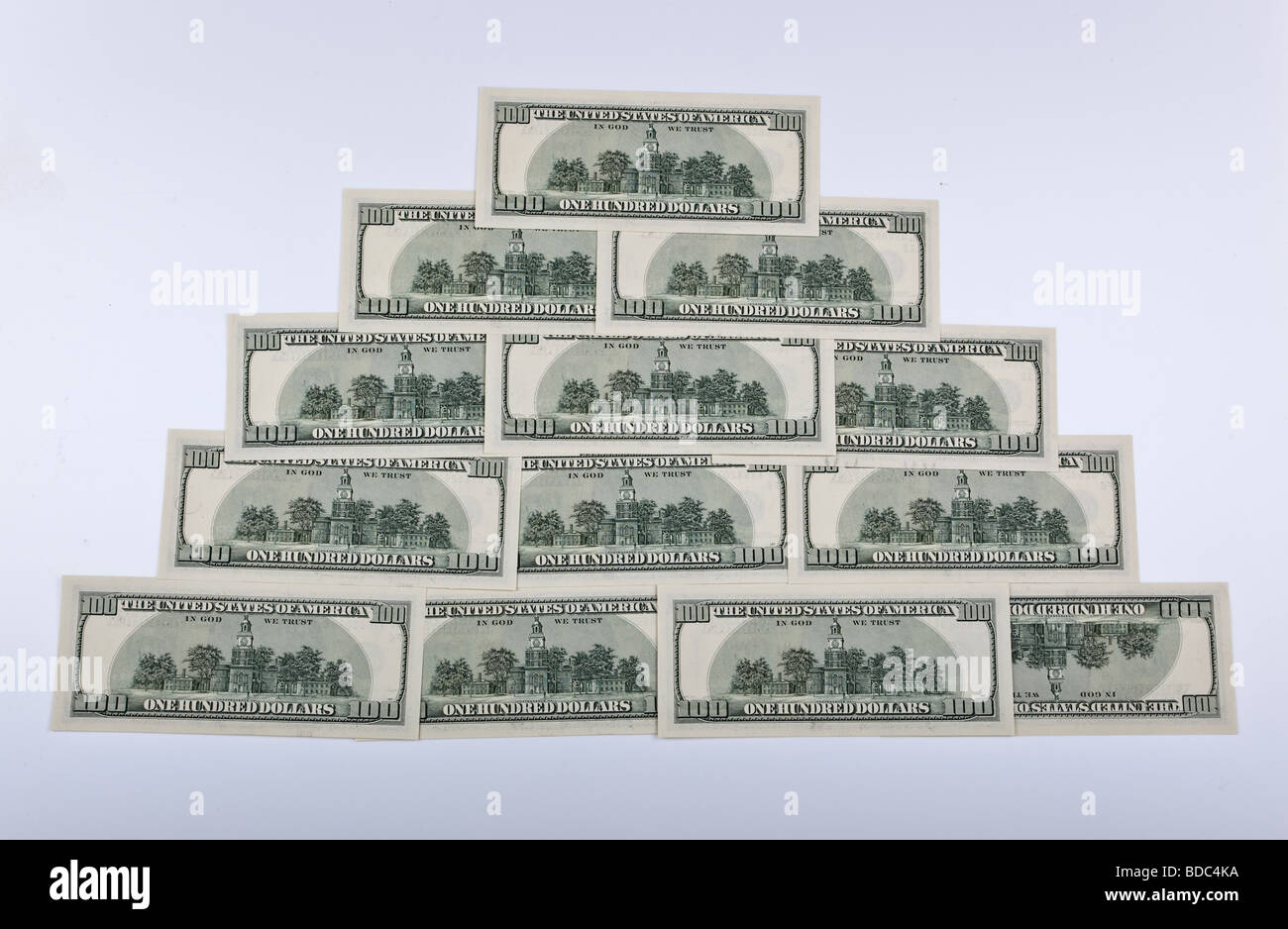 Financial pyramid collected from 13 denominations of dollars Stock Photo