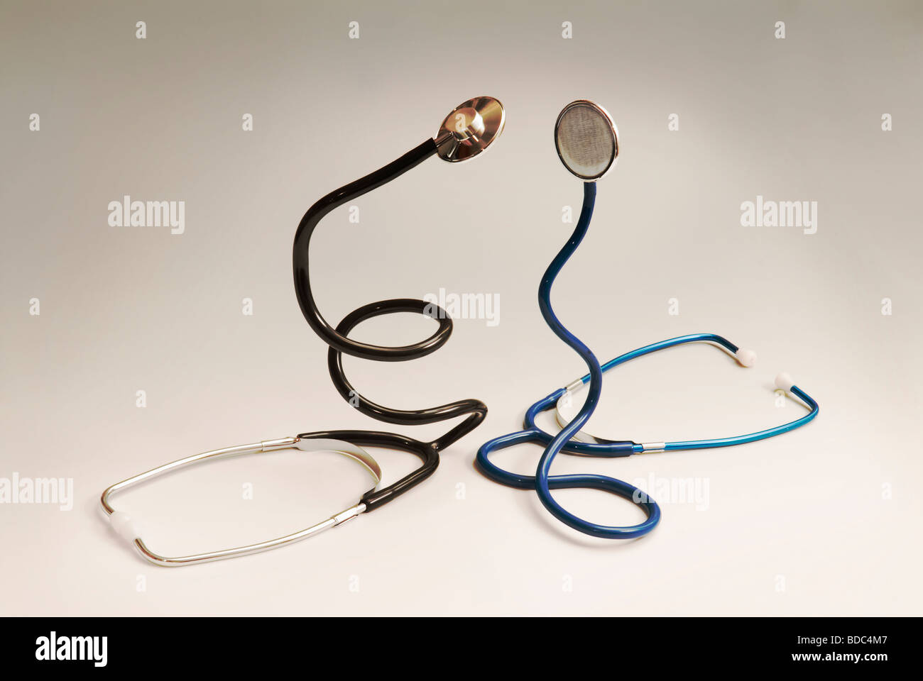 two stethoscopes coiled like snakes Stock Photo