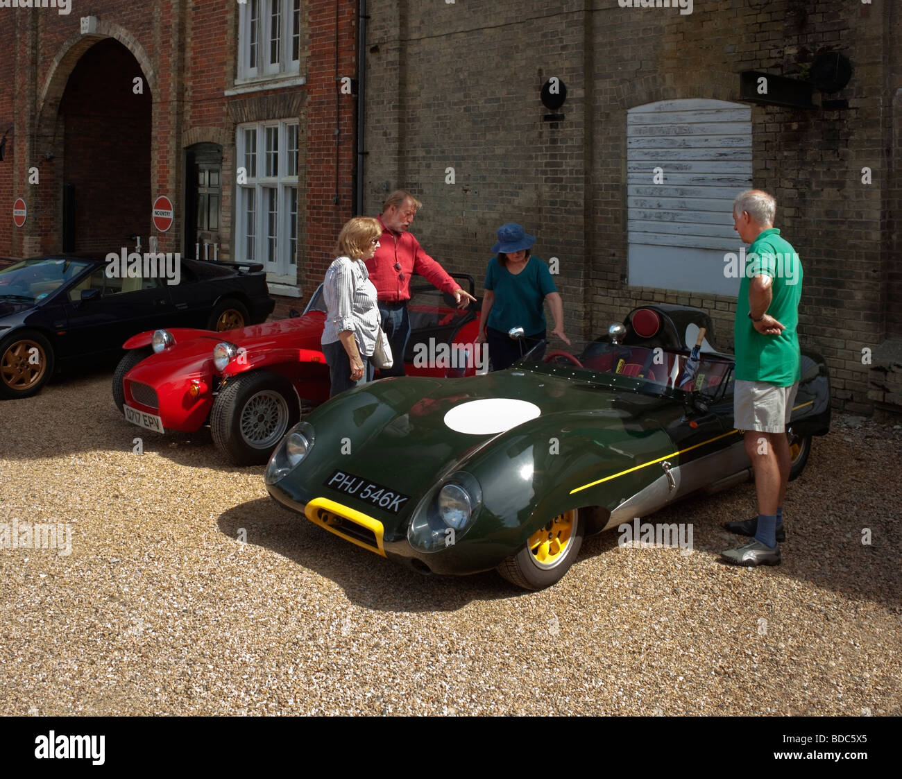 Car enthusiasts admiring a Lotus 11 classic sports car Stock Photo Alamy