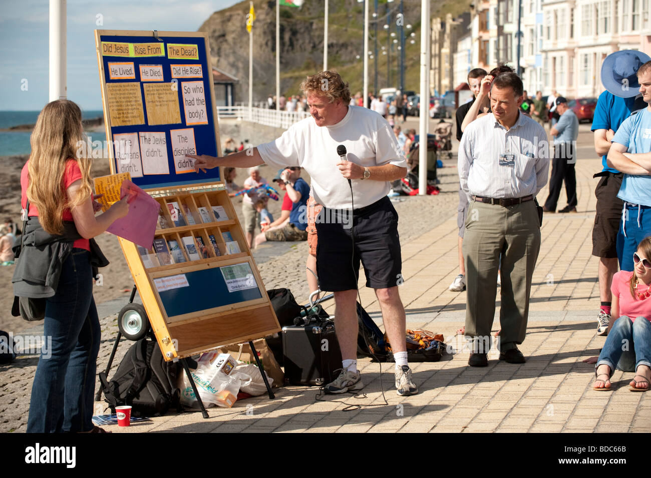 Born again Christian evangelist proselytizing on the street as part of a seaside beach mission Aberystwyth Wales UK Stock Photo