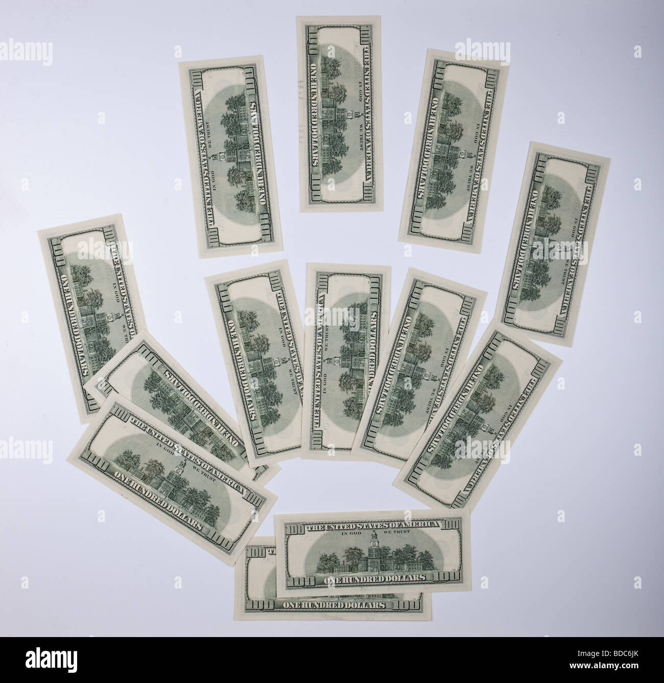Hand of the person collected from 13 denominations of dollars Stock Photo