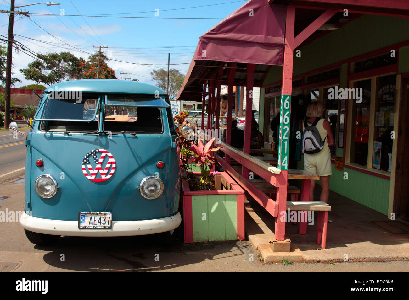 Volkswagen microbus with VW logo painted with stars and stripes parked in Haleiwa Oahu Hawaii Stock Photo