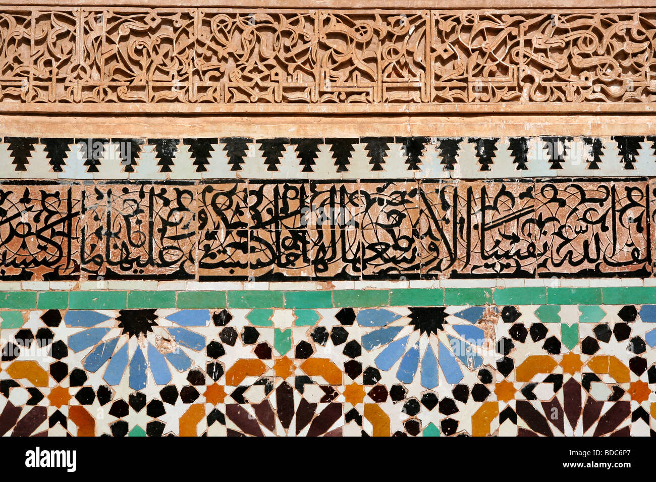 Colorful Islamic tiles, Arabic calligraphy and stucco designs in the