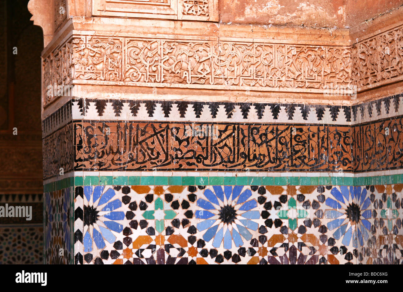 Colorful Islamic tiles, Arabic calligraphy and stucco designs in the Saadian Tombs,  Marrakesh, Morocco (16th century) Stock Photo