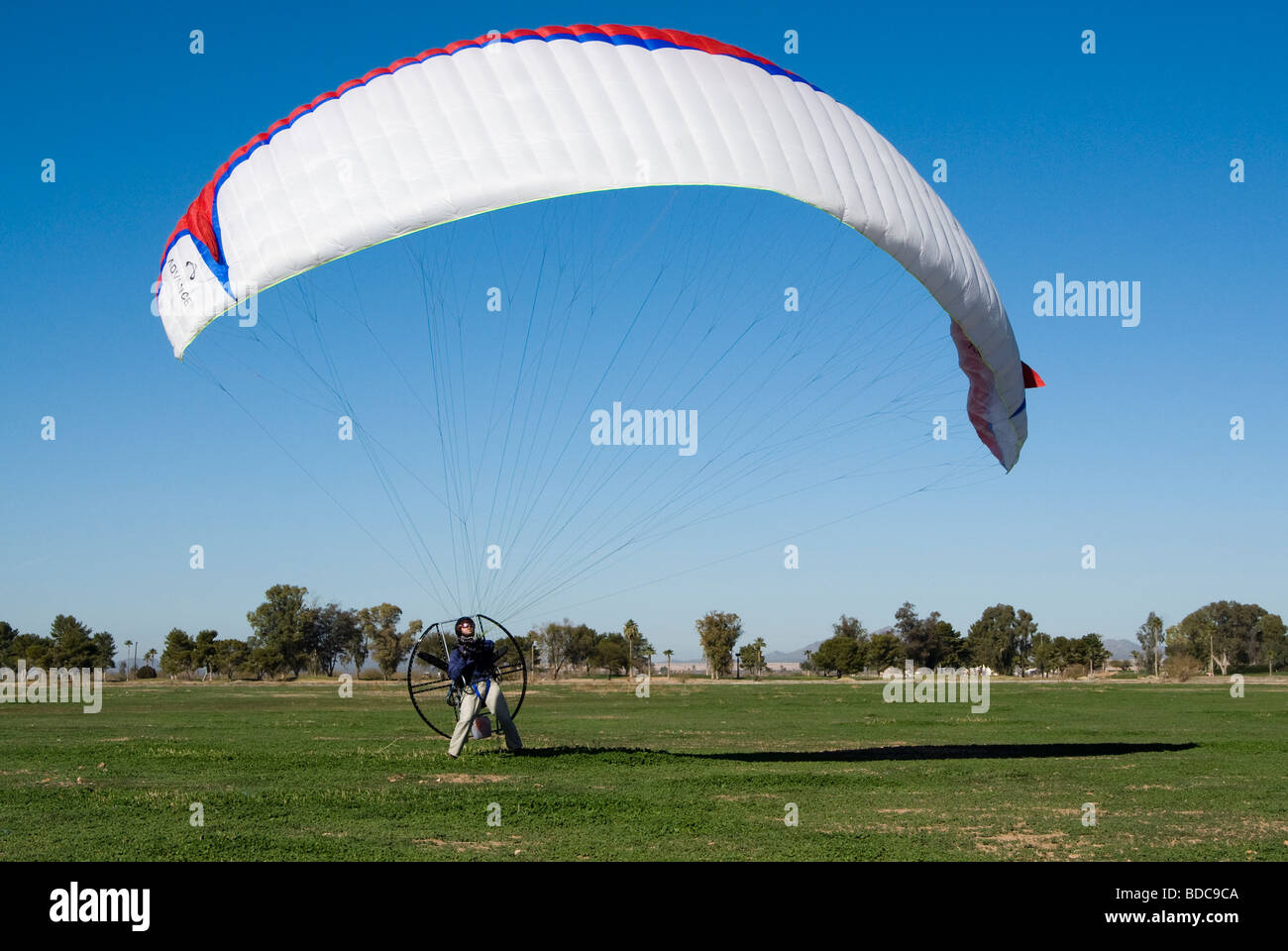a powered paraglider pilot prepares to take off Stock Photo Alamy